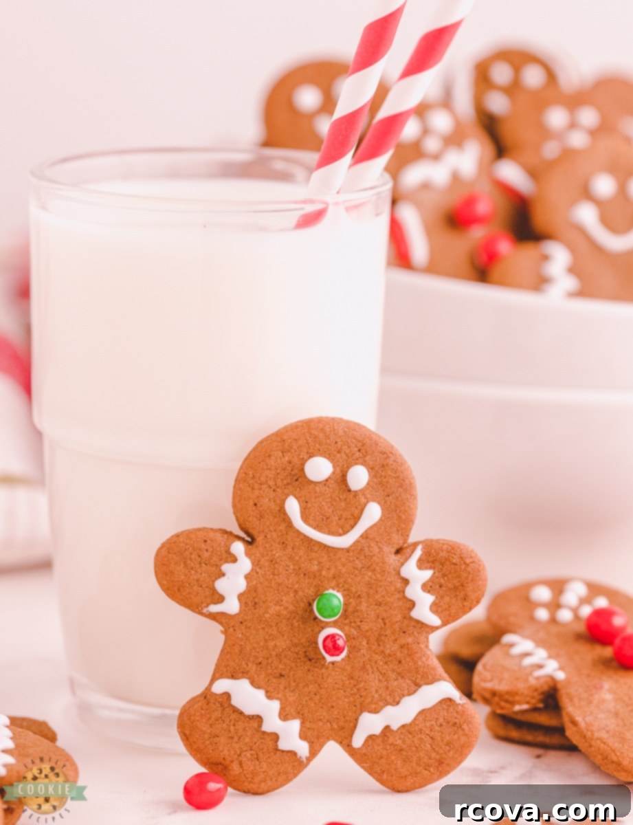 Perfectly Crafted Gingerbread Cut-Outs 9 gingerbread boy cookie next to a glass of milk