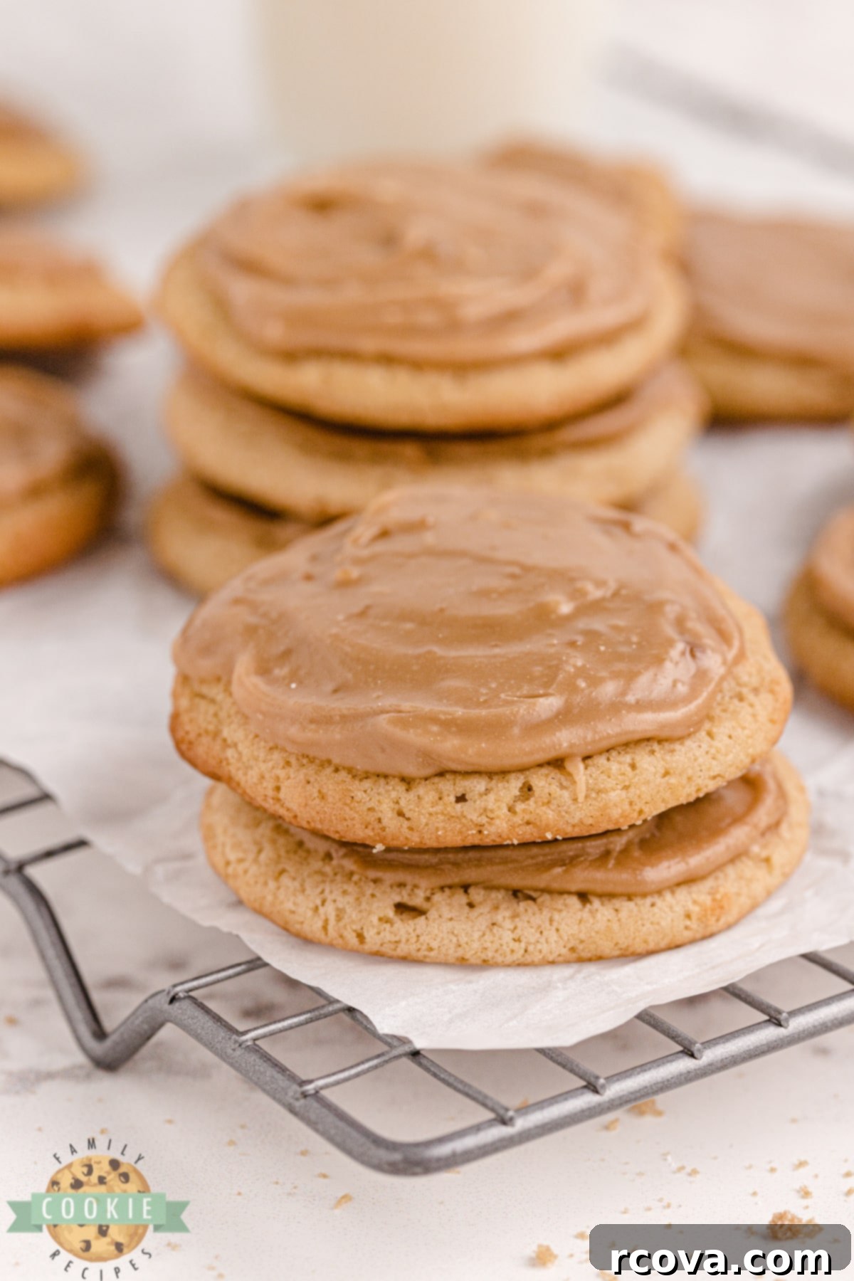 Decadent Frosted Brown Sugar Treats 2 Frosted Brown Sugar Cookies are soft and chewy with a simple brown sugar frosting on top. Easy cookie recipe with a rich brown sugar flavor that is absolutely delicious! A plate of golden brown cookies with swirls of light brown frosting.