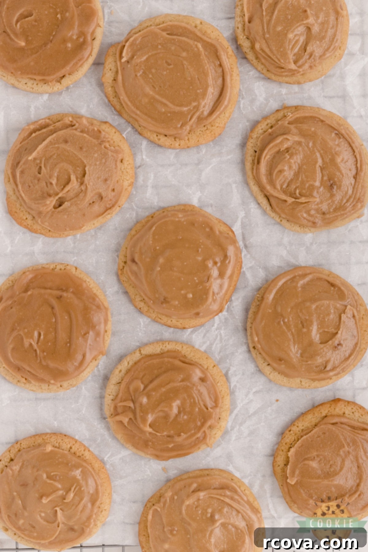 Decadent Frosted Brown Sugar Treats 6 Finished Frosted Brown Sugar Cookies stacked on a plate, showing their soft texture and smooth frosting.