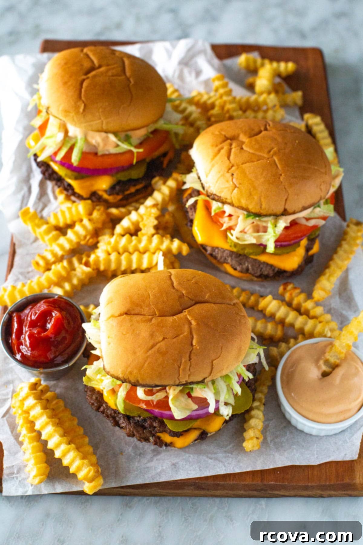 The Perfect Homemade Smash Burger 8 A delicious homemade smash burger with a side of crispy fries, accompanied by ketchup and homemade special sauce for dipping.
