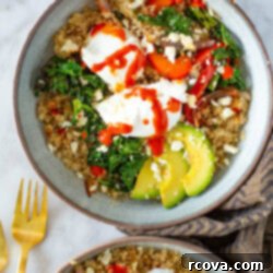 Hearty Savory Quinoa Breakfast Bowl 10 A close-up of a quinoa breakfast bowl with poached eggs, avocado and hot sauce.