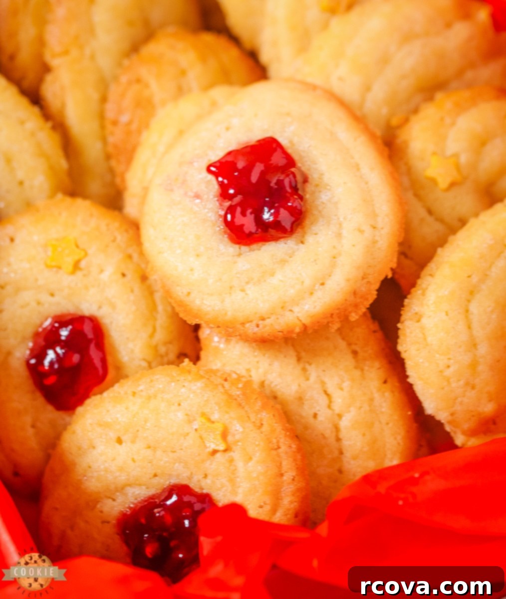 Classic Danish Butter Delights 3 Assortment of homemade Danish butter cookies in various traditional shapes, beautifully arranged.