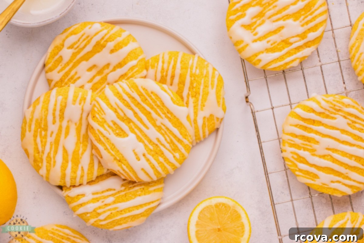Cloud-Soft Lemon Glaze Treats 3 Soft Glazed Lemon Cookies on a plate