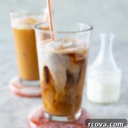 Unlock the Secrets to Amazing Iced Coffee 10 Two glasses of iced coffee with a jar of milk.
