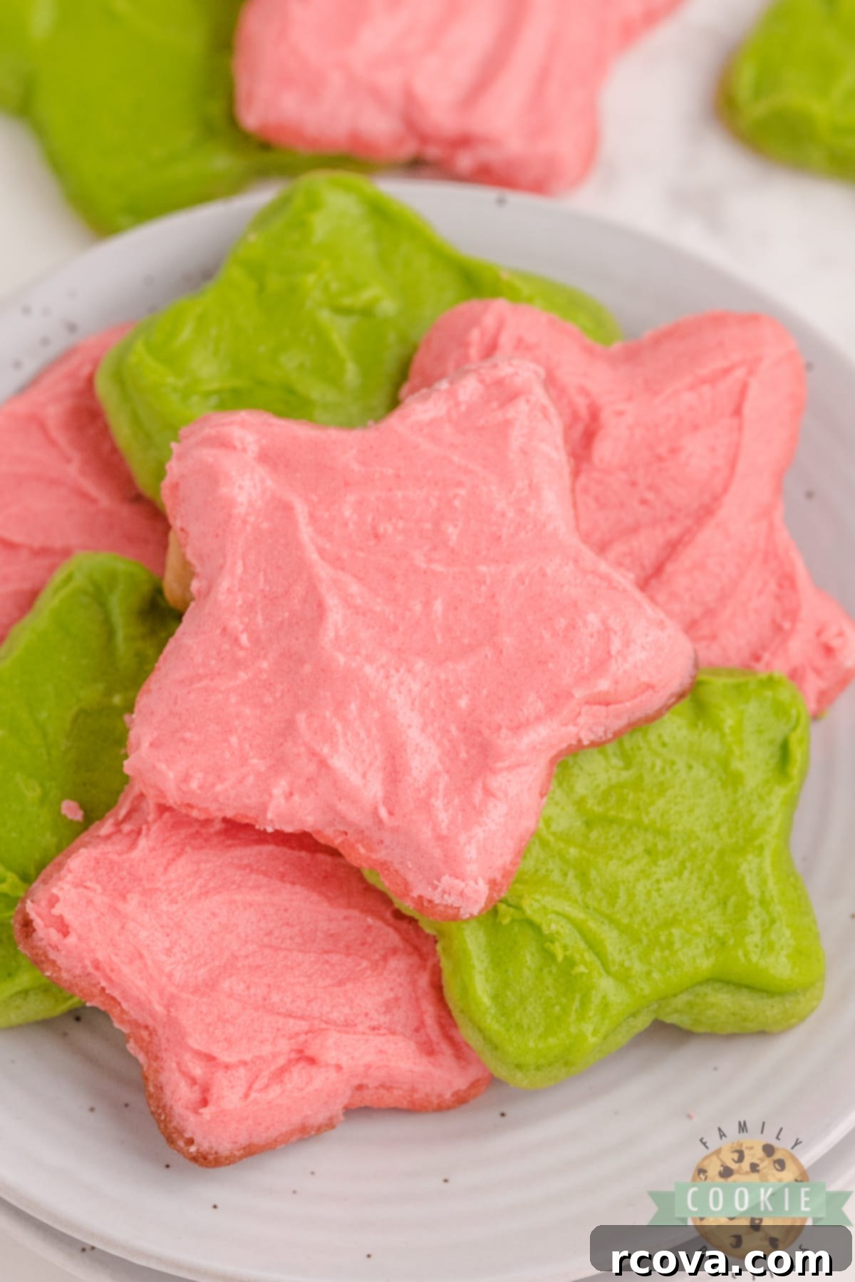 Jiggly & Jolly Christmas Sugar Cookies 2 Christmas Jello Sugar Cookies made with red and green Jello in the cookies and the frosting. Festive and flavorful cut-out sugar cookies that can be made with any flavor of Jello!