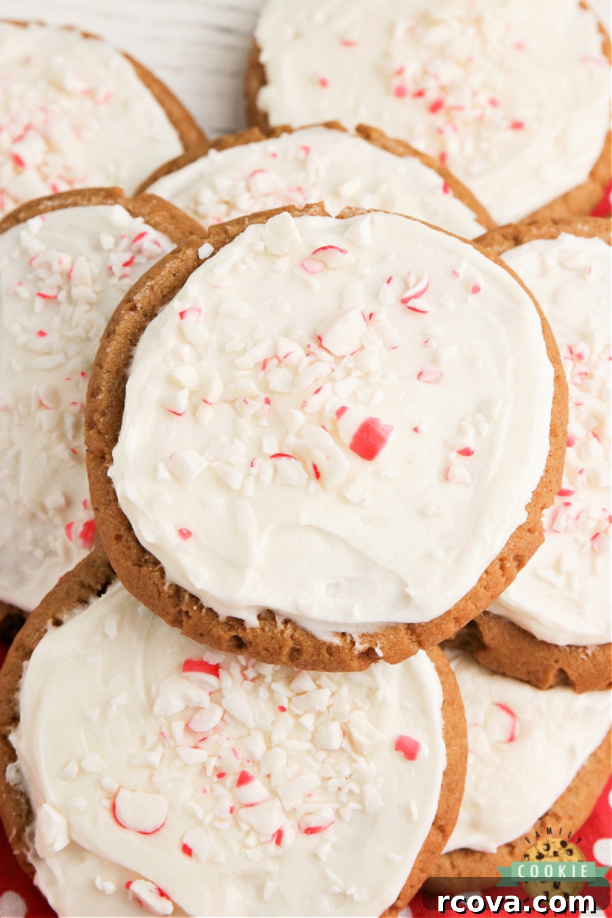 Festive Frosted Gingerbread Delights 9 Close-up of frosted gingerbread cookies with white buttercream.