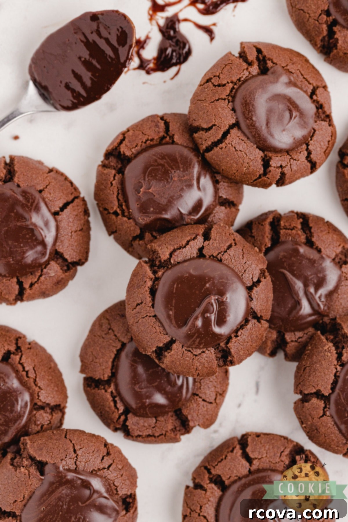 Decadent Double Chocolate Thumbprints 3 A platter of beautifully arranged Double Chocolate Thumbprint Cookies, showcasing their uniform size and the generous chocolate ganache filling in each center.