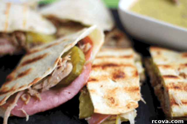 Grilled Cuban Melt 3 Ingredients for Cuban Sandwich Quesadillas including shredded pork, cheese, and tortillas
