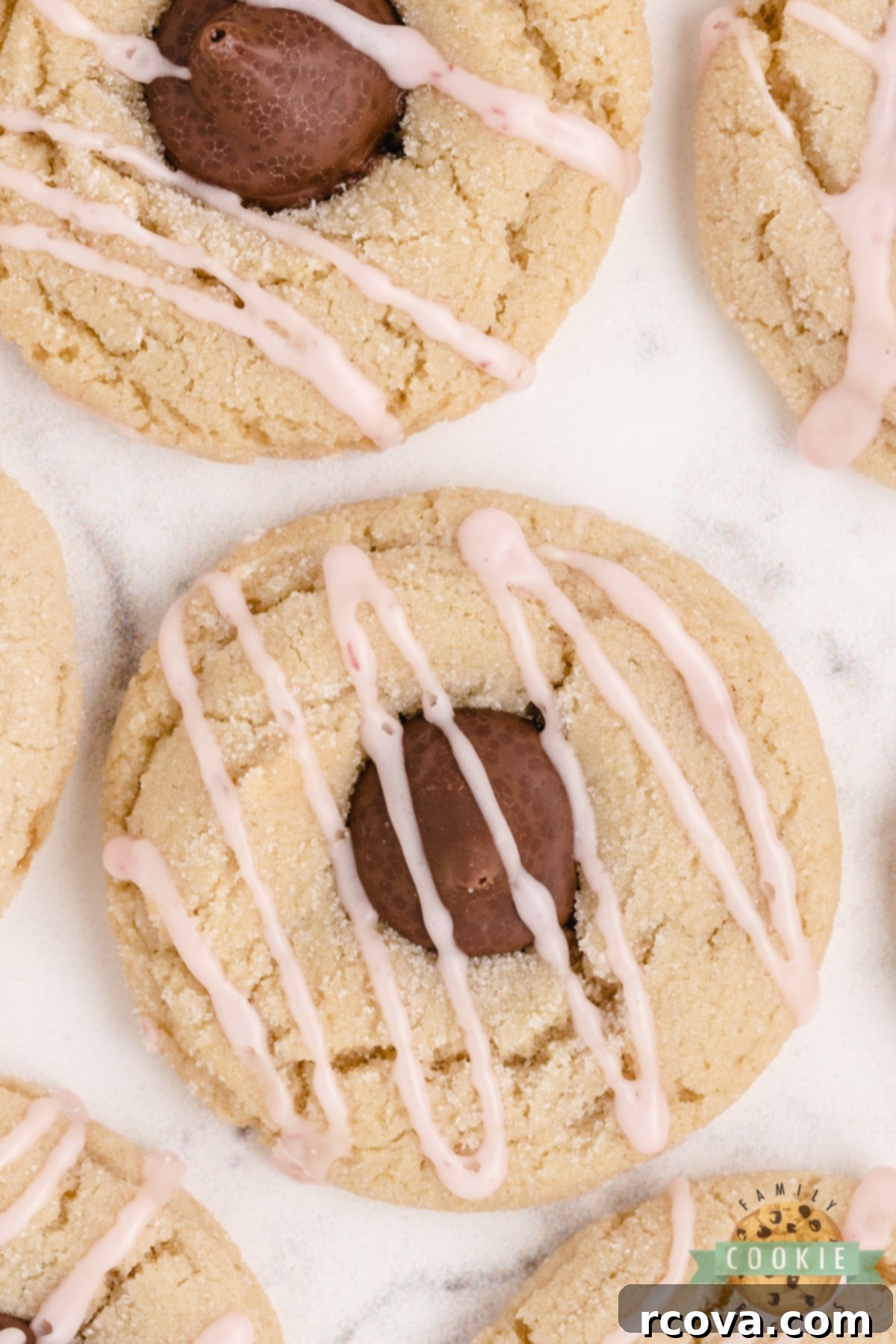 Almond Kissed Delights 9 A beautiful stack of Almond Kiss Cookies, perfectly baked and garnished with raspberry glaze and a chocolate kiss.