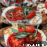 One-Pan Balsamic Caprese Chicken 6 A pan with chicken, tomatoes and mozzarella cheese on it.