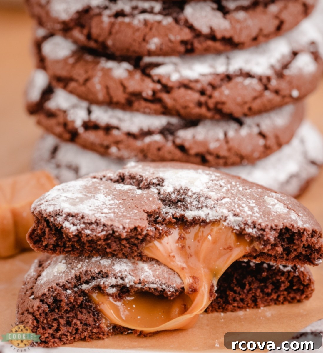 Chocolate Crinkles with a Caramel Heart 8 Freshly baked Caramel Chocolate Crinkle Cookies on a cooling rack, some with a visible caramel center.