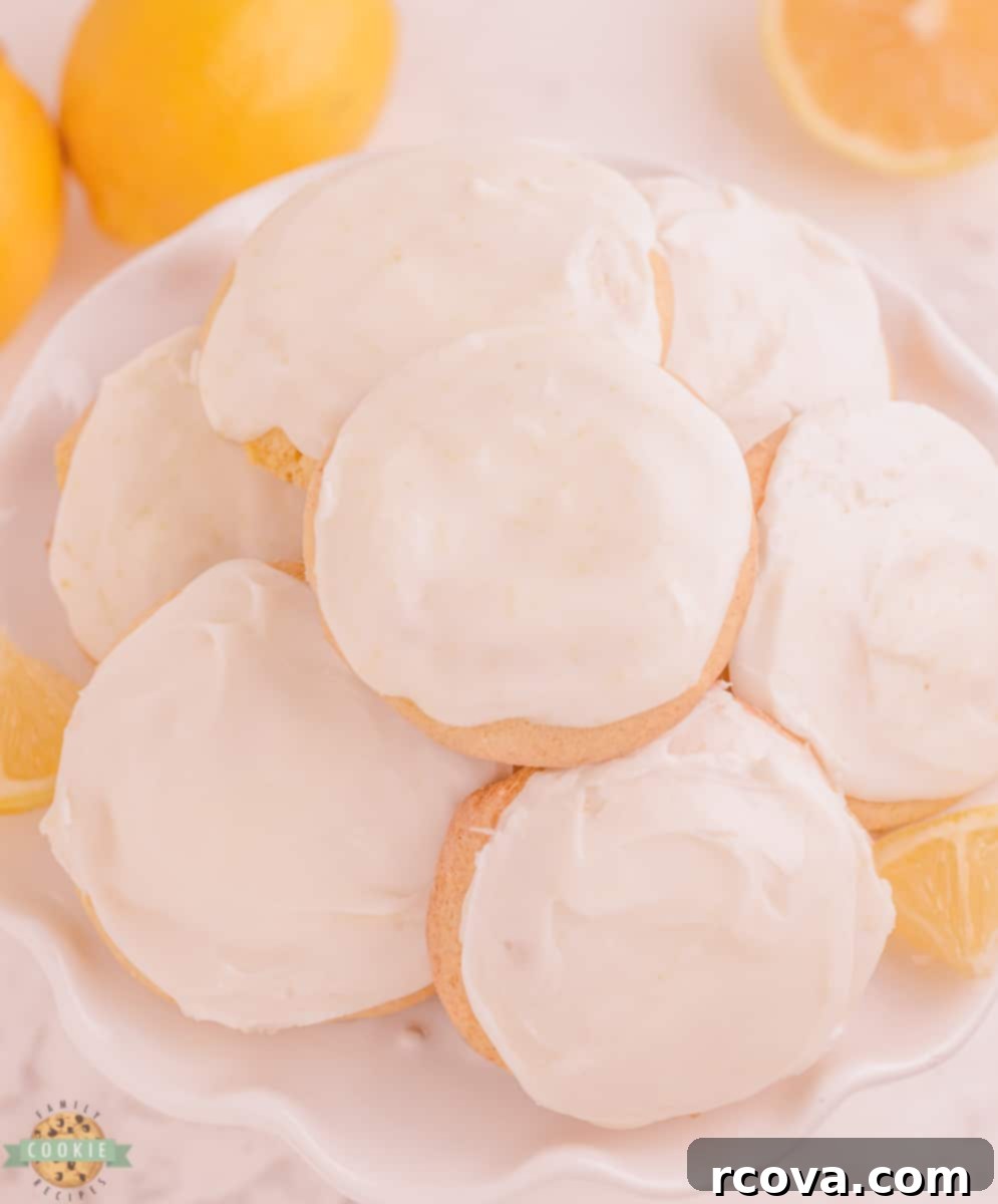 Cool Whip Lemon Cake Cookies 7 Close-up of lemon cake mix Cool Whip cookies with a vanilla glaze, ready for serving or storage.