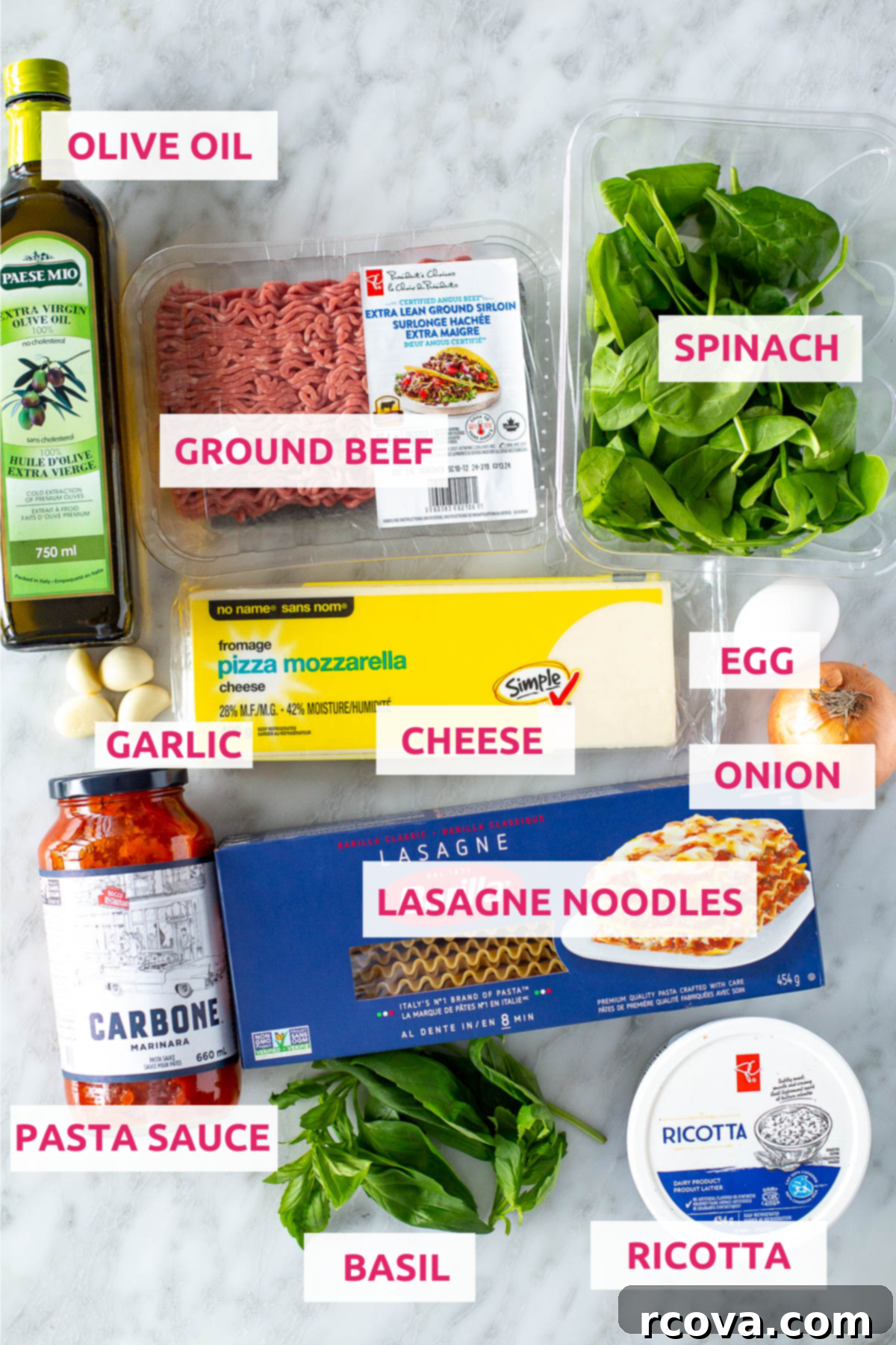 Effortless Lasagna Roll-Ups: A Delicious Family Meal 4 Ingredients for lasagna roll-ups laid out on a countertop, including lasagna noodles, ricotta, ground beef, spinach, and mozzarella cheese.