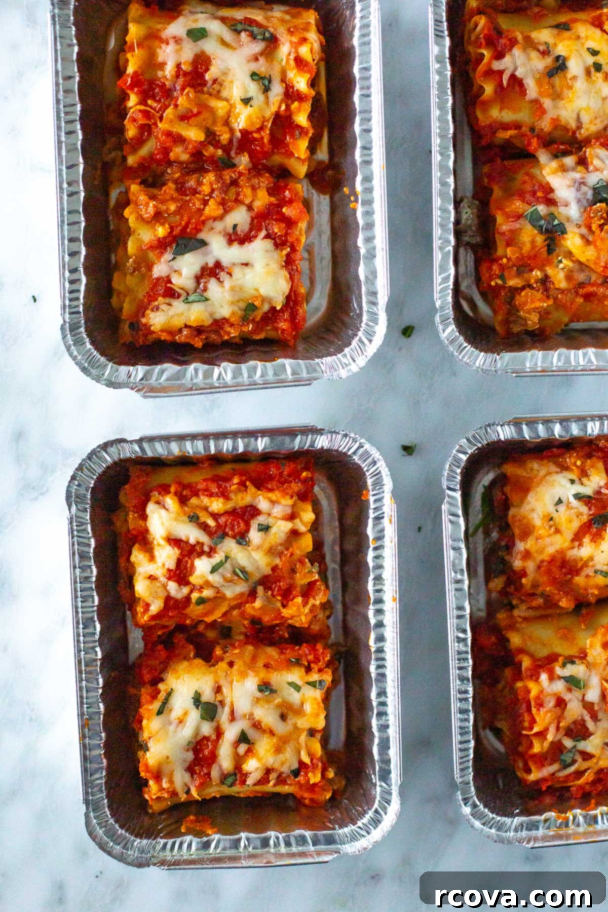 Effortless Lasagna Roll-Ups: A Delicious Family Meal 10 Lasagna roll-ups packed into meal prep containers, ready for storage or freezing.