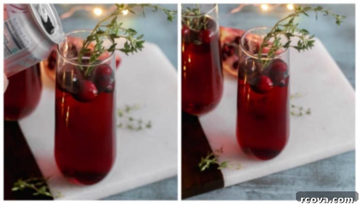 Quick & Bubbly Berry Pomegranate Mocktail 3 Close-up of Sparkling Berry and Pomegranate Mocktail with cranberries and thyme, showcasing its vibrant color