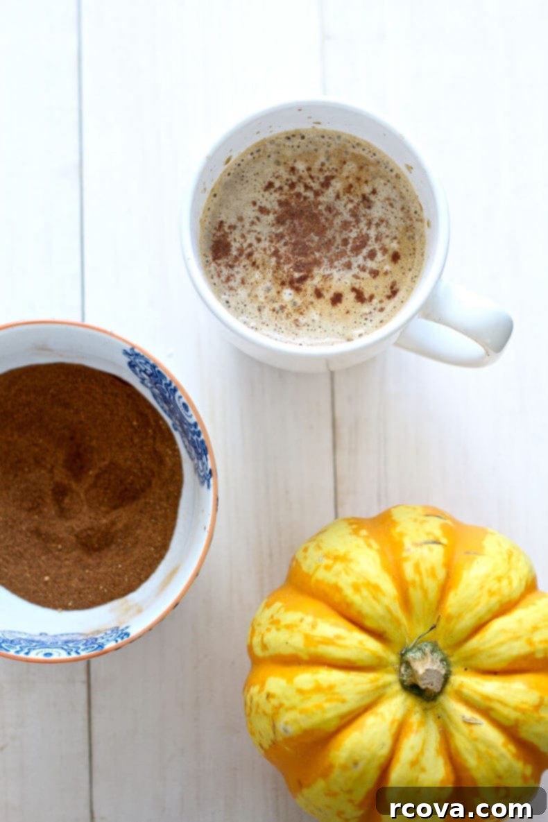Your Perfect At-Home Starbucks Pumpkin Spice Latte 6 Enjoying a homemade Pumpkin Spice Latte with fall decor