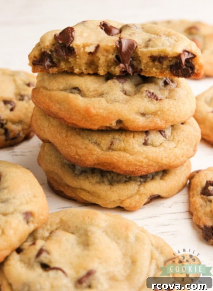 Irresistible Homemade Chocolate Chip Cookie Recipes 19 Bakery Style Chocolate Chip Cookies, large and golden, stacked up.
