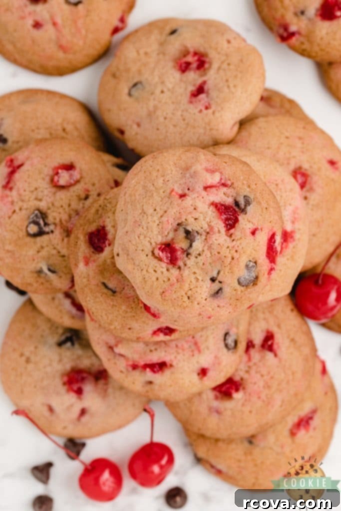 Irresistible Homemade Chocolate Chip Cookie Recipes 31 Cherry Chocolate Chip Cookies, soft and chewy, with bits of red cherries visible.
