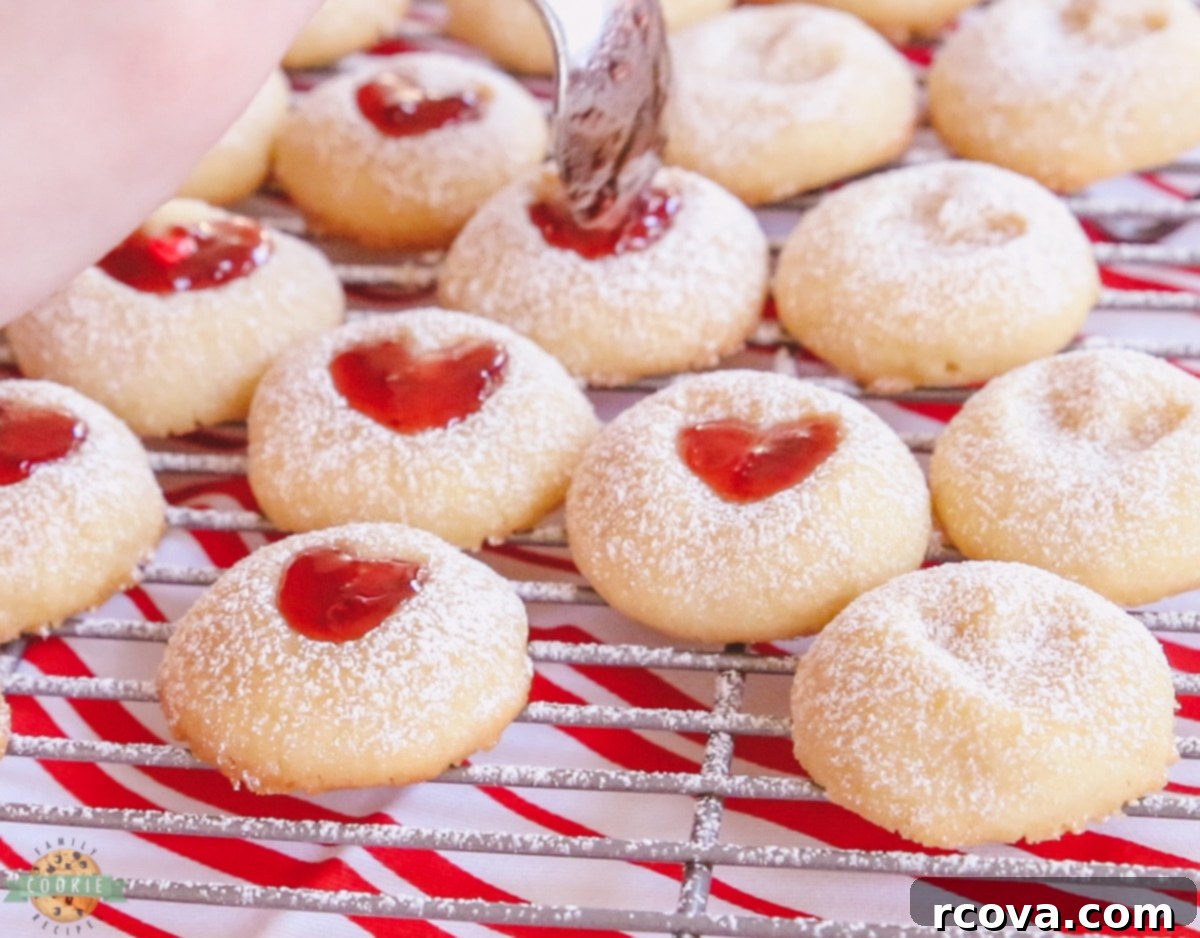 Sweetheart Thumbprint Cookies 5 filling the heart with jam in thumbprint cookies