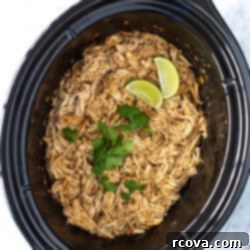 Perfectly Tender Slow Cooker Chicken 10 overhead shot of shredded chicken in a slow cooker - 1