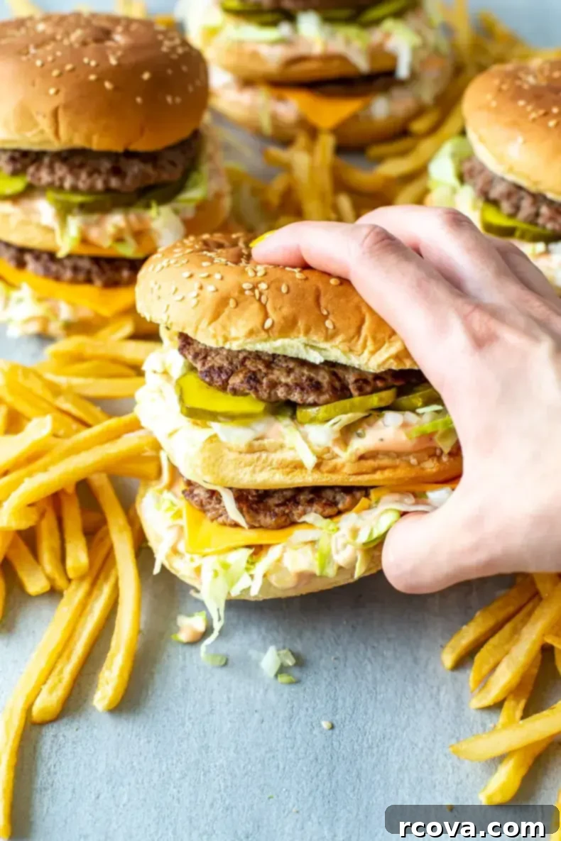 Your 3-Ingredient Big Mac Sauce Secret 6 Overhead shot of a delicious homemade Big Mac with crisp French fries on the side, ready to be enjoyed with the special sauce.