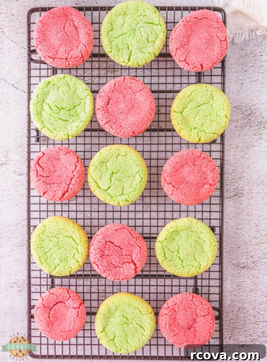 Vibrant Jello Cookies 5 Freshly baked Jello cookies cooling on a wire rack, showing off their perfectly rounded shape and colorful tops.