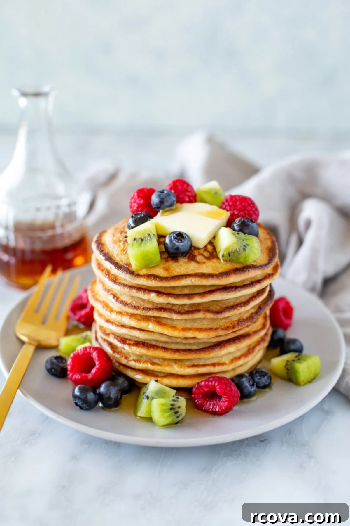Protein-Packed Cottage Cheese Pancakes 10 Overhead shot of cottage cheese pancakes with berries on top and around - 1