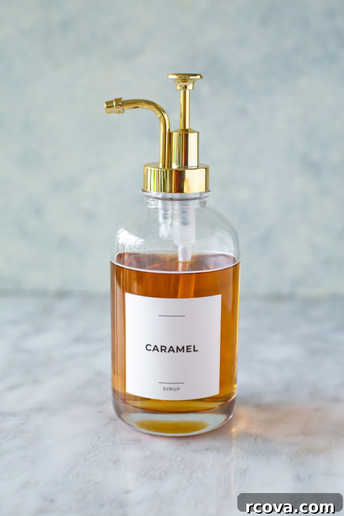 Barista Style Caramel Syrup for Iced Coffee 11 A glass jar filled with luscious homemade caramel syrup, featuring a neat label, ready for use or gifting.