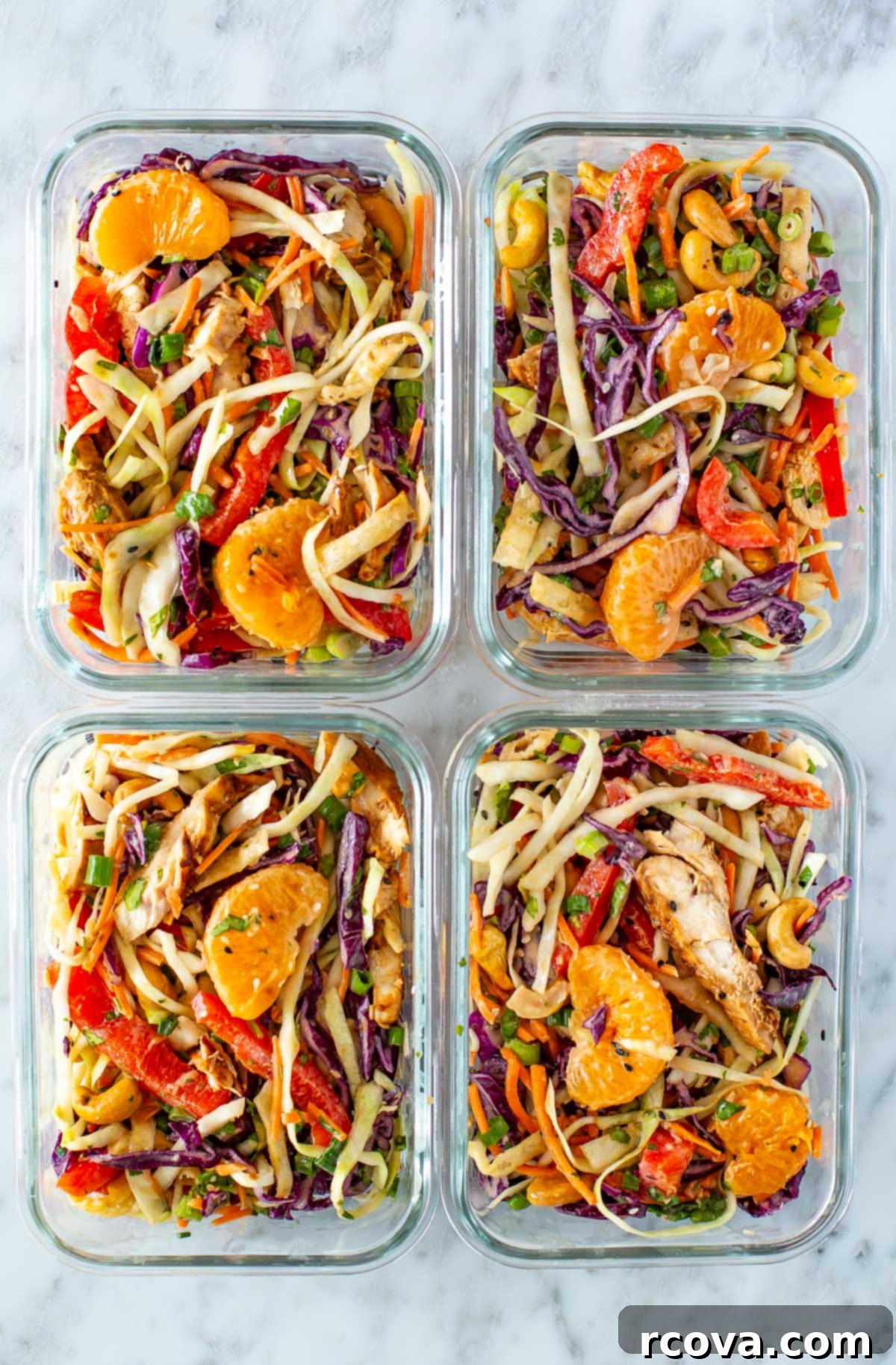 Vibrant Mandarin Chicken Salad 10 Four glass meal prep containers, each with a serving of Mandarin Chicken Salad, perfect for weekly meals.