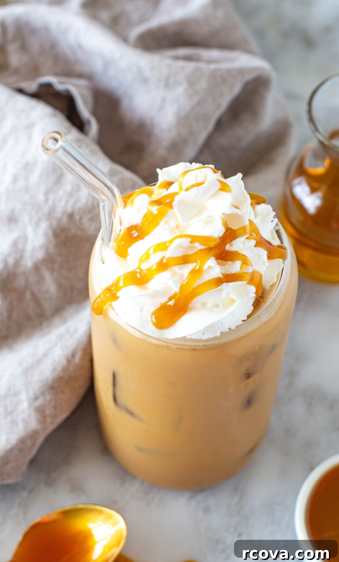 Effortless Iced Caramel Latte Dream 7 An inviting overhead shot of a freshly made Iced Caramel Latte, adorned with whipped cream and a luxurious caramel drizzle.
