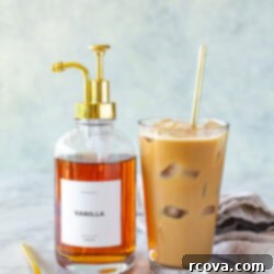 Easy Homemade Vanilla Syrup for Iced Coffee 9 Side shot of homemade iced coffee and vanilla syrup pump