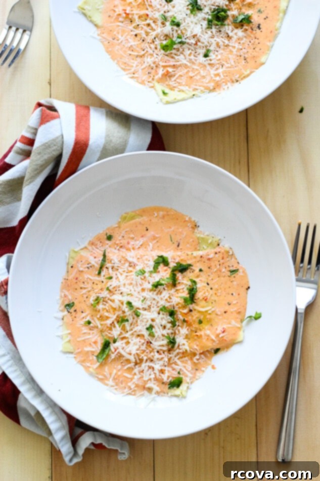 Hand-Rolled Butternut Squash Ravioli 2 Butternut Squash Ravioli in a Red Pepper Cream Sauce, garnished with fresh herbs