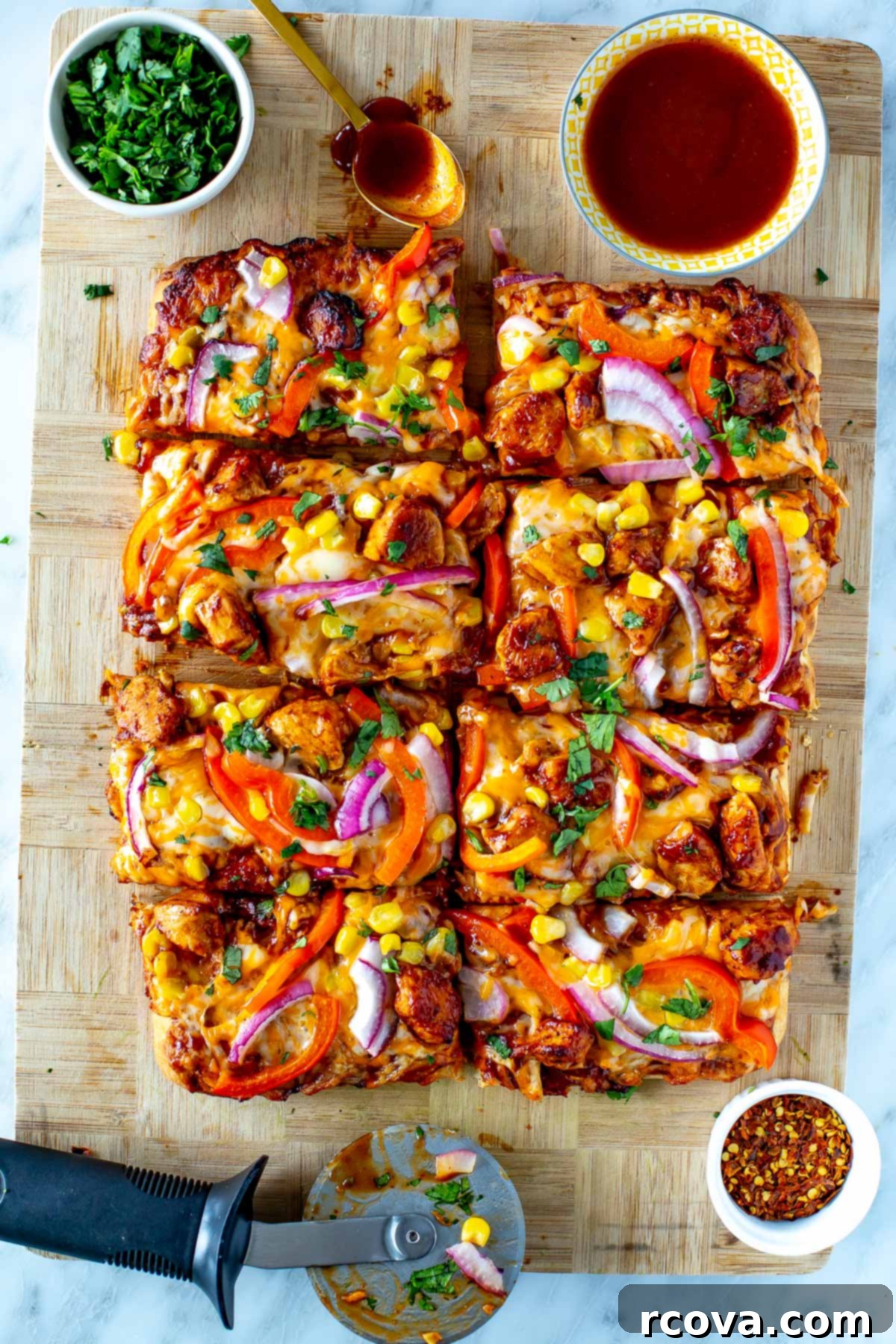 Effortless BBQ Chicken Flatbread 8 overhead shot of a whole BBQ Chicken Flatbread, uncut, on a rustic wooden board.