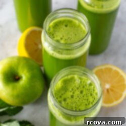 Your Quick Green Elixir 10 Overhead shot of green juice in four glasses with lemons and mint.