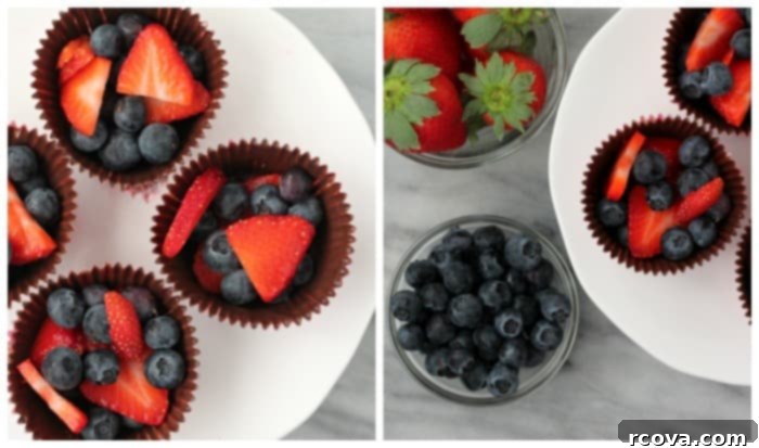 Decadent Chocolate Fruit Bites 2 Close-up of a chocolate fruit cup filled with fresh raspberries and blueberries, ready to eat.