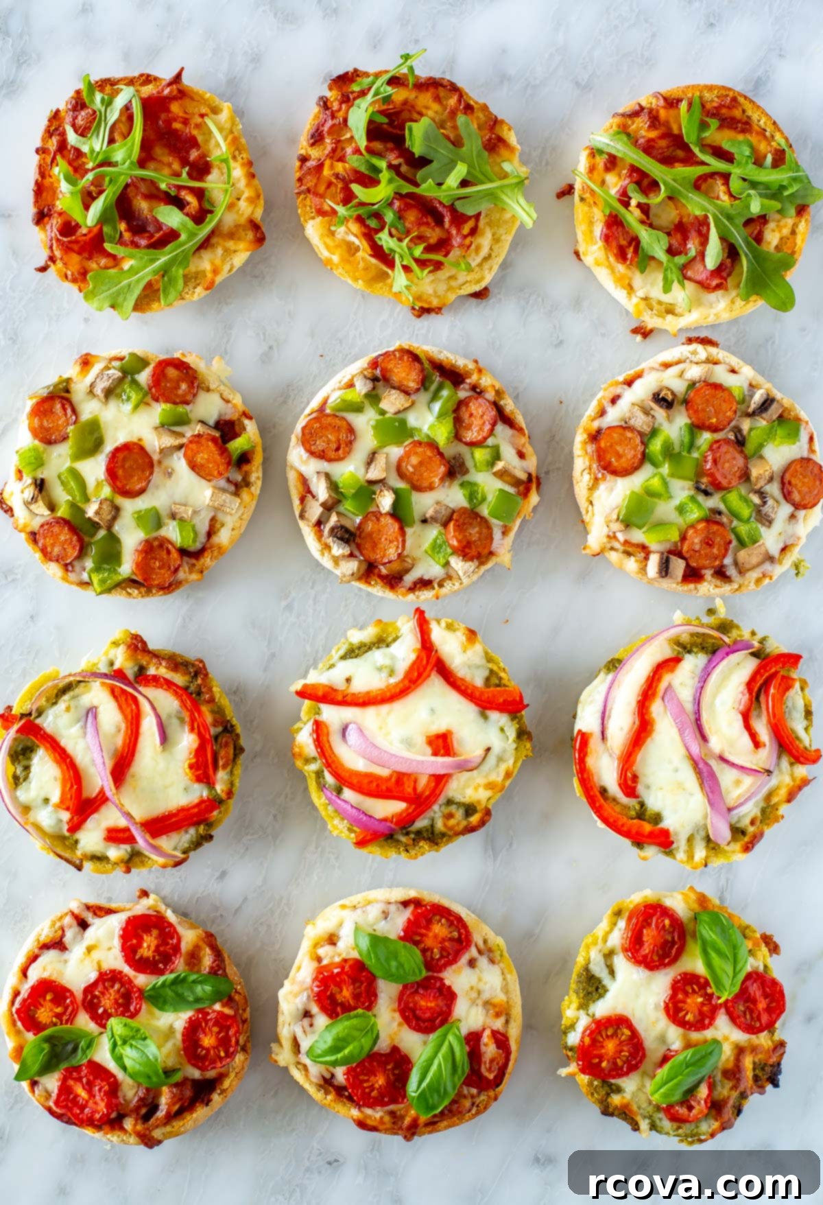 Whip Up Simple Mini Pizzas at Home 7 12 different english muffin pizzas on a marble slab.