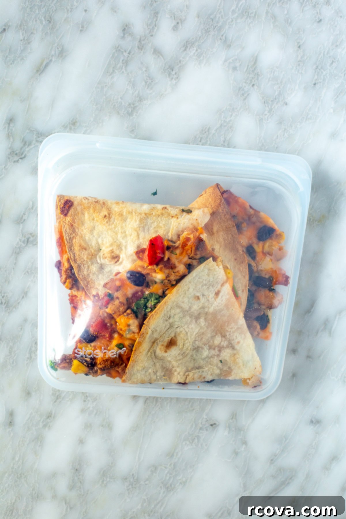 One-Pan Quesadilla Perfection 10 Overhead shot of cooked quesadilla slices inside a clear storage bag.