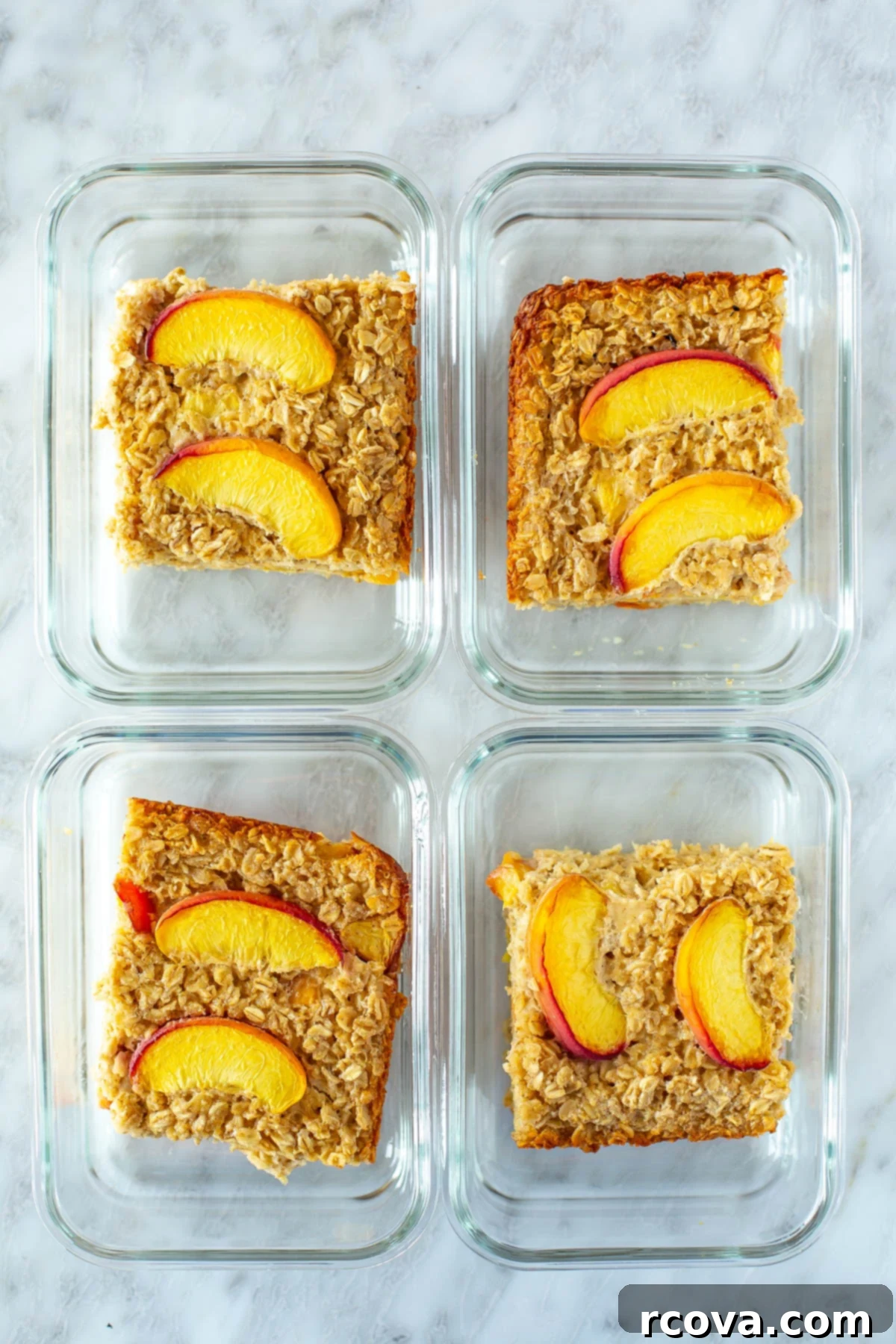 Protein-Packed Peachy Baked Oats 10 Overhead shot of four meal prep containers filled with individual portions of baked peach oatmeal, ideal for weekly planning.