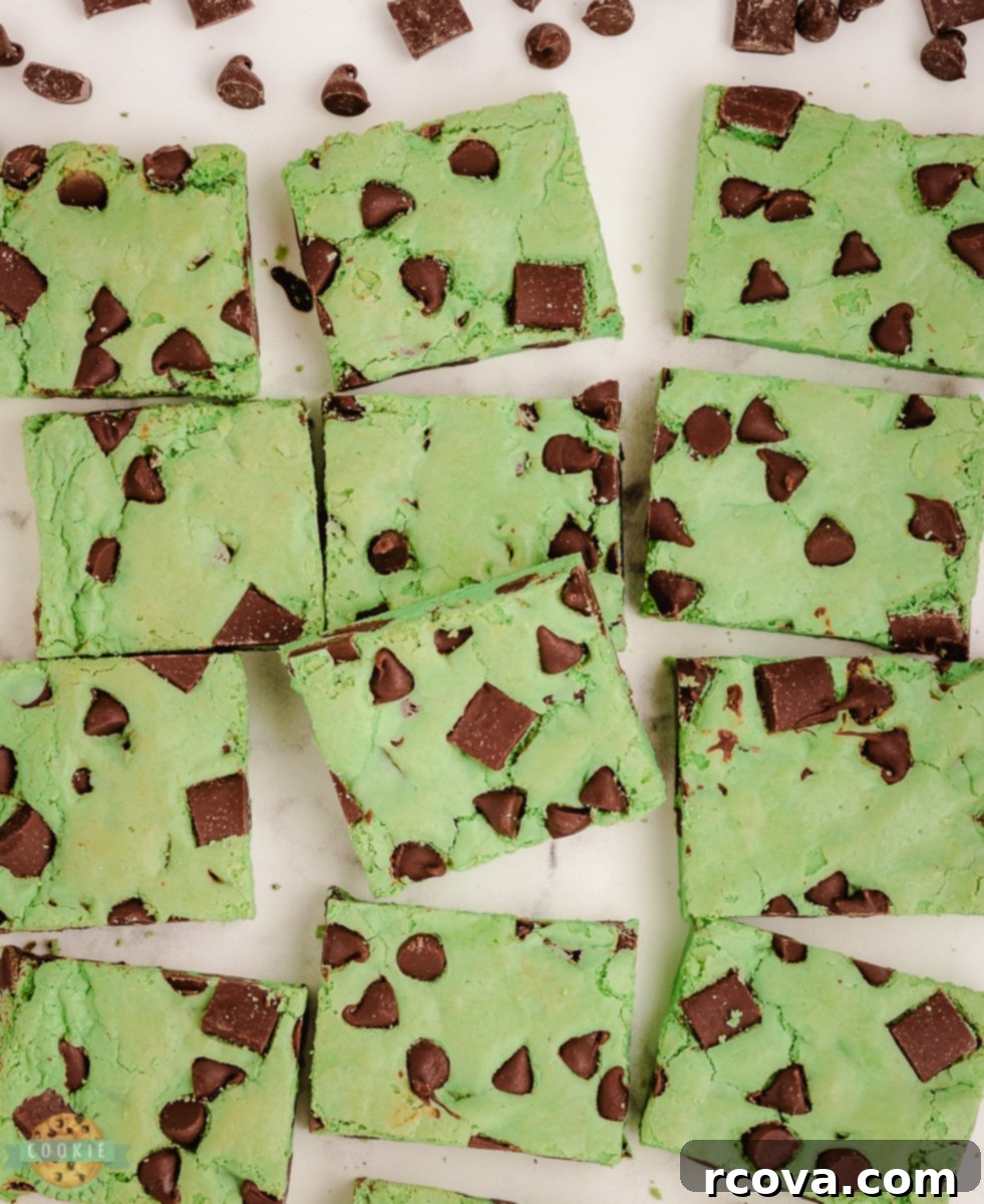 Refreshing Mint Chocolate Chip Cookie Bars 6 Green mint chocolate chip cookie bars neatly cut into perfect squares, ready for serving.