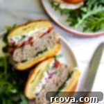 Silken Feta Turkey Burgers 5 A perfectly grilled turkey burger patty topped with creamy whipped feta spread on a brioche bun.