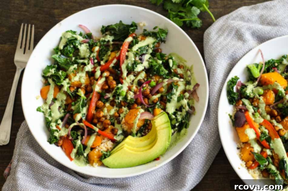 Tahini Drizzled Kale Quinoa Power Bowl 4 Warm Tahini Kale and Quinoa Bowl featuring healthy, colorful vegetables and roasted chickpeas.
