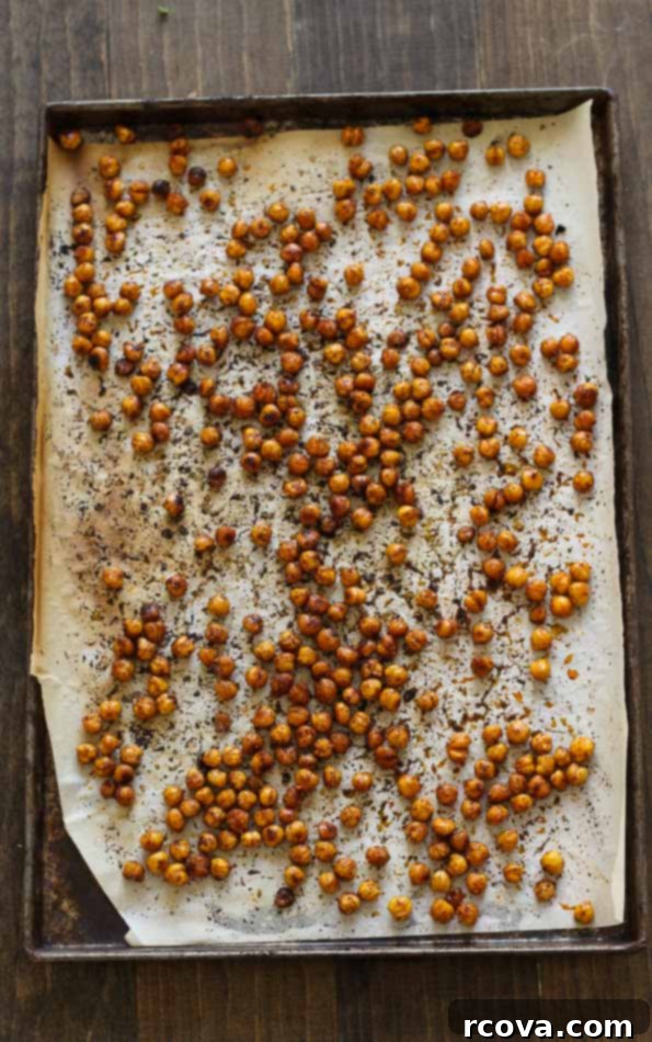 Tahini Drizzled Kale Quinoa Power Bowl 6 Close-up of crispy roasted chickpeas, a key component of the healthy bowl.