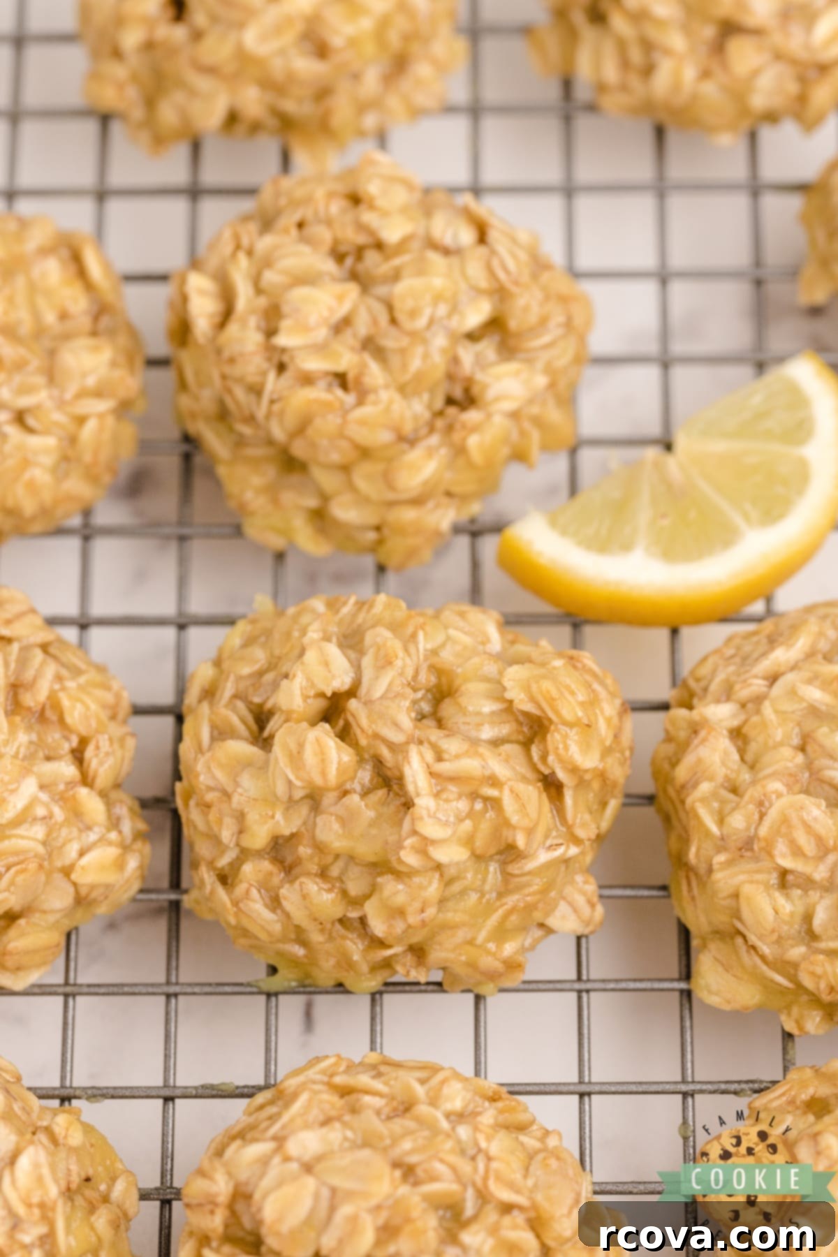 Zesty Lemon No-Bake Oatmeal Cookies 3 Close-up view of Lemon No Bake Cookies setting on wax paper, highlighting their light color and soft texture, promising a delightful citrus treat.