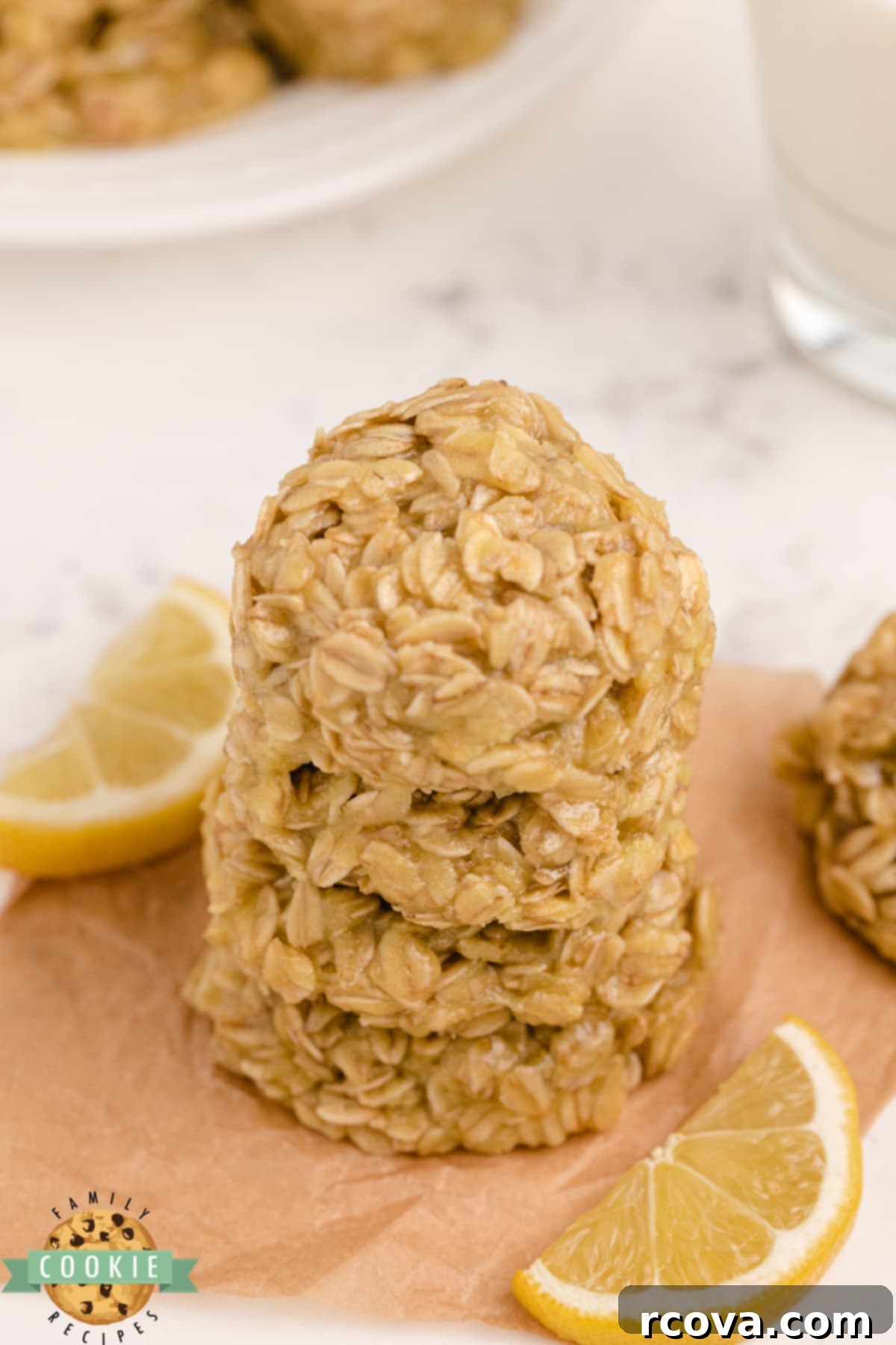 Zesty Lemon No-Bake Oatmeal Cookies 9 Lemon Oatmeal No Bake Cookies arranged neatly on a plate, garnished with lemon zest, highlighting their fresh and inviting appearance.