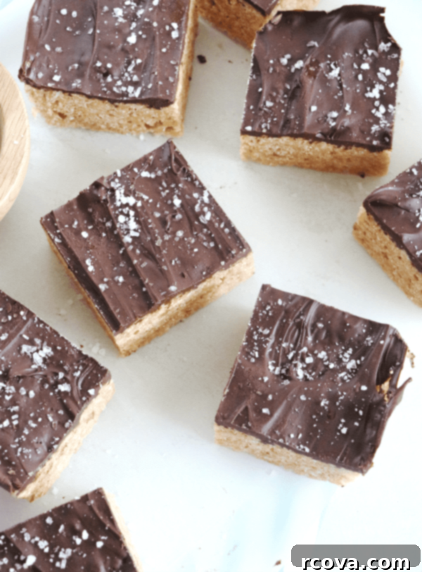Salty Sweet Peanut Butter Chocolate Crunch 5 Overhead shot of Salted Chocolate Peanut Butter Krispie Treats with a knife, ready for slicing