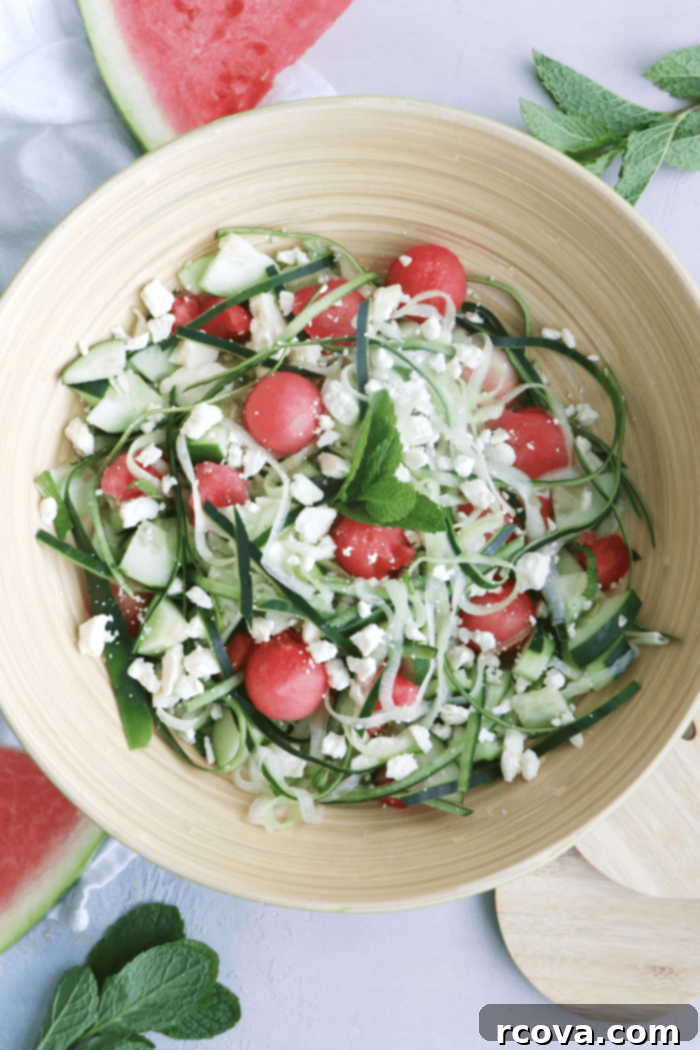 Watermelon Feta Mint Oasis 2 Vibrant Watermelon Feta Salad with fresh mint and cucumber, served in a white bowl