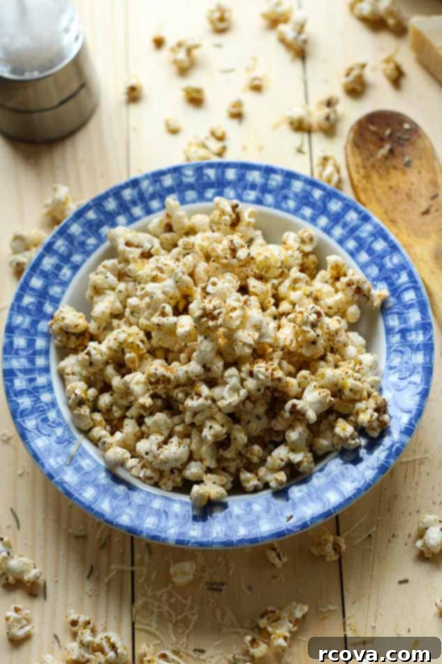 Simple Garlic Parmesan Popcorn 10 Easy Spicy Garlic Parmesan Popcorn in a large, colorful bowl, capturing the inviting texture and rich seasoning of the snack.