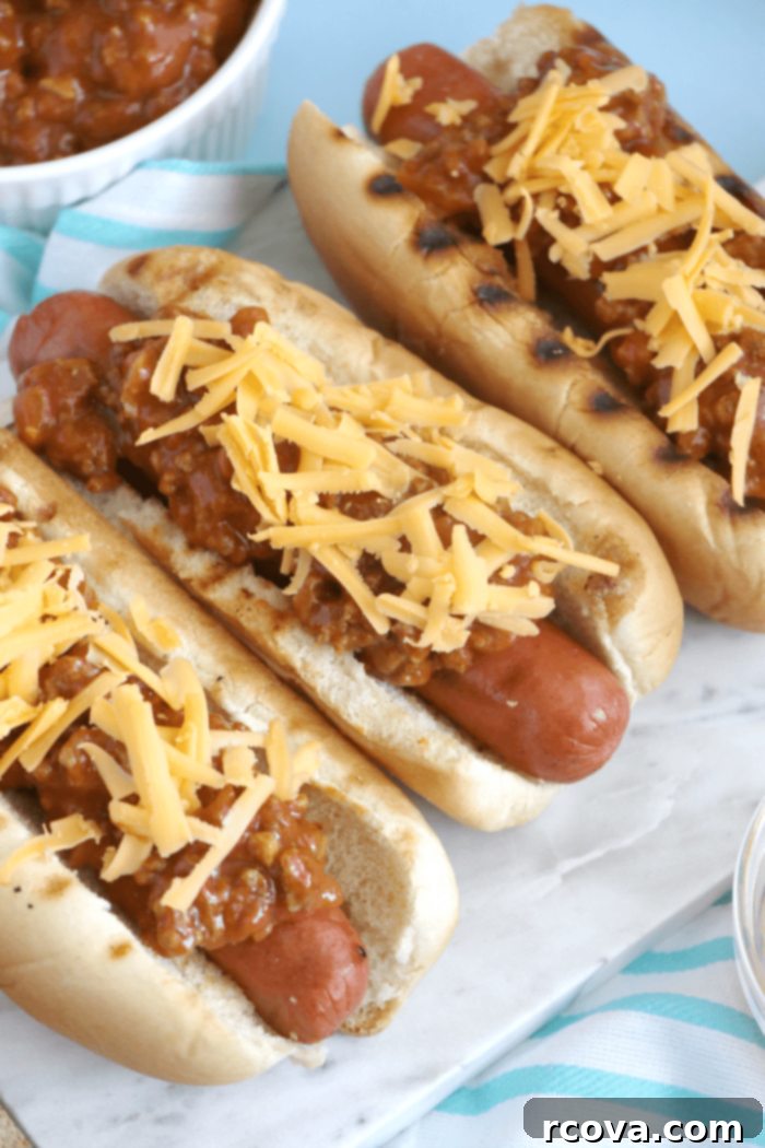 Classic Chili Cheese Dogs 5 Freshly grilled hot dogs awaiting homemade chili and cheese