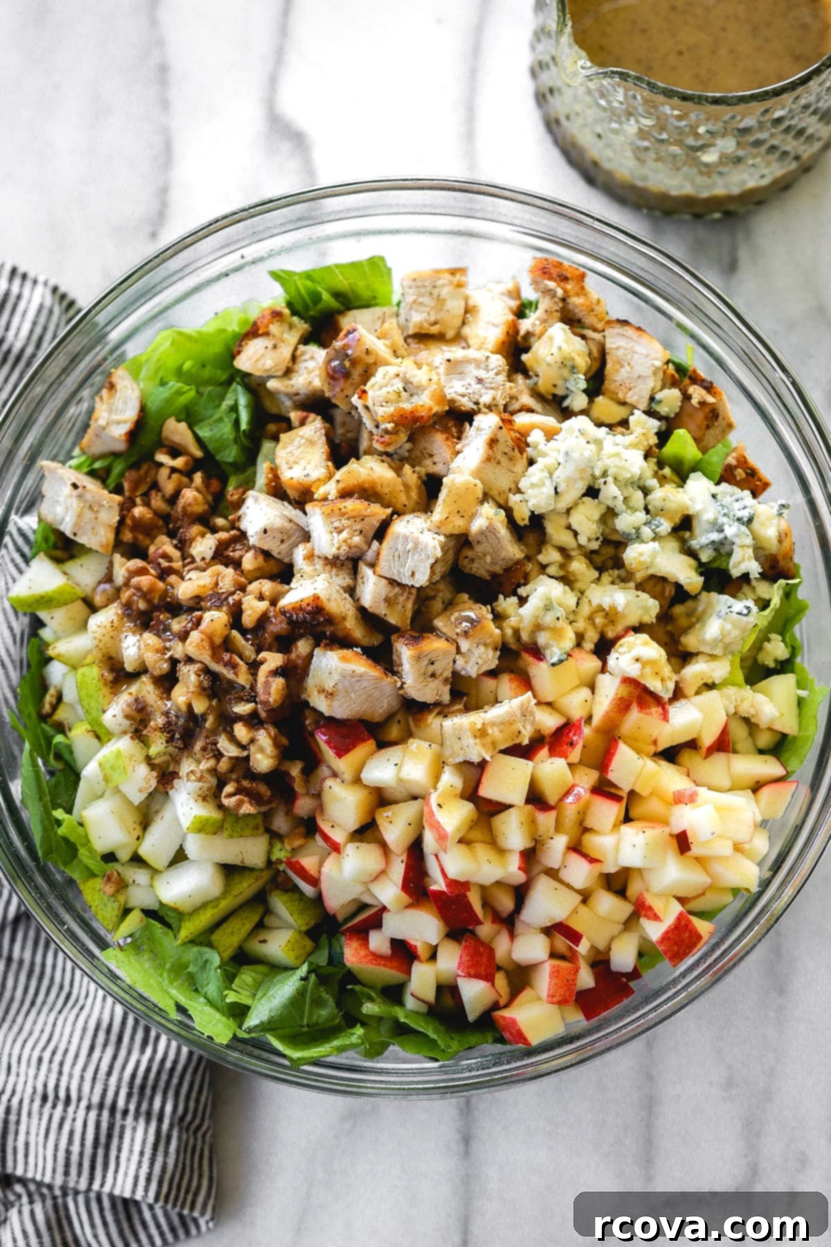 Crisp Harvest Chicken Salad with Pear Apple Blue Cheese 3 Close-up of Chicken Harvest Salad components including blue cheese, walnuts, and dressing