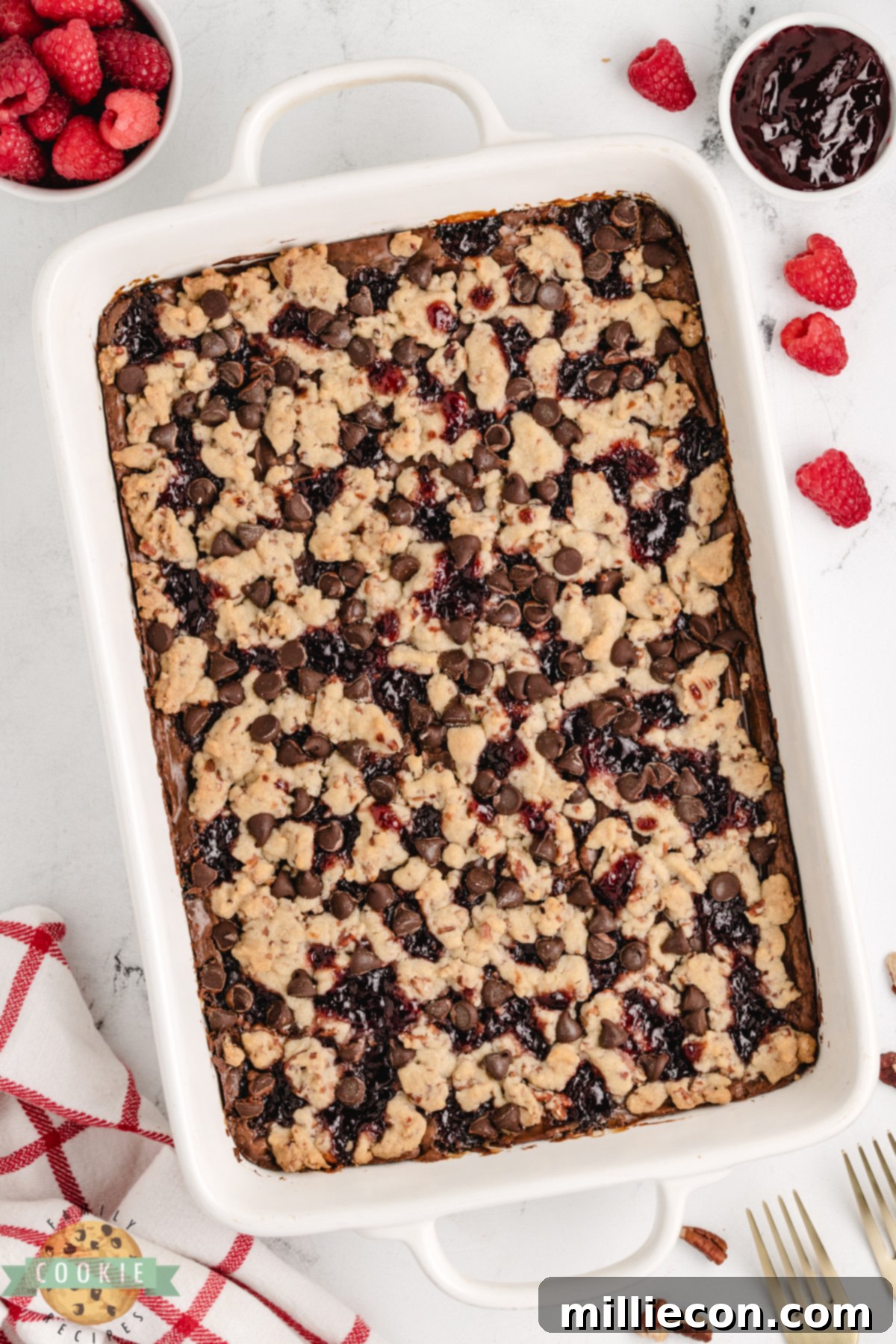 Chocolate Raspberry Crumble Bars 5 Chocolate raspberry shortbread cookie bars in a 9x13 pan with crumb topping.